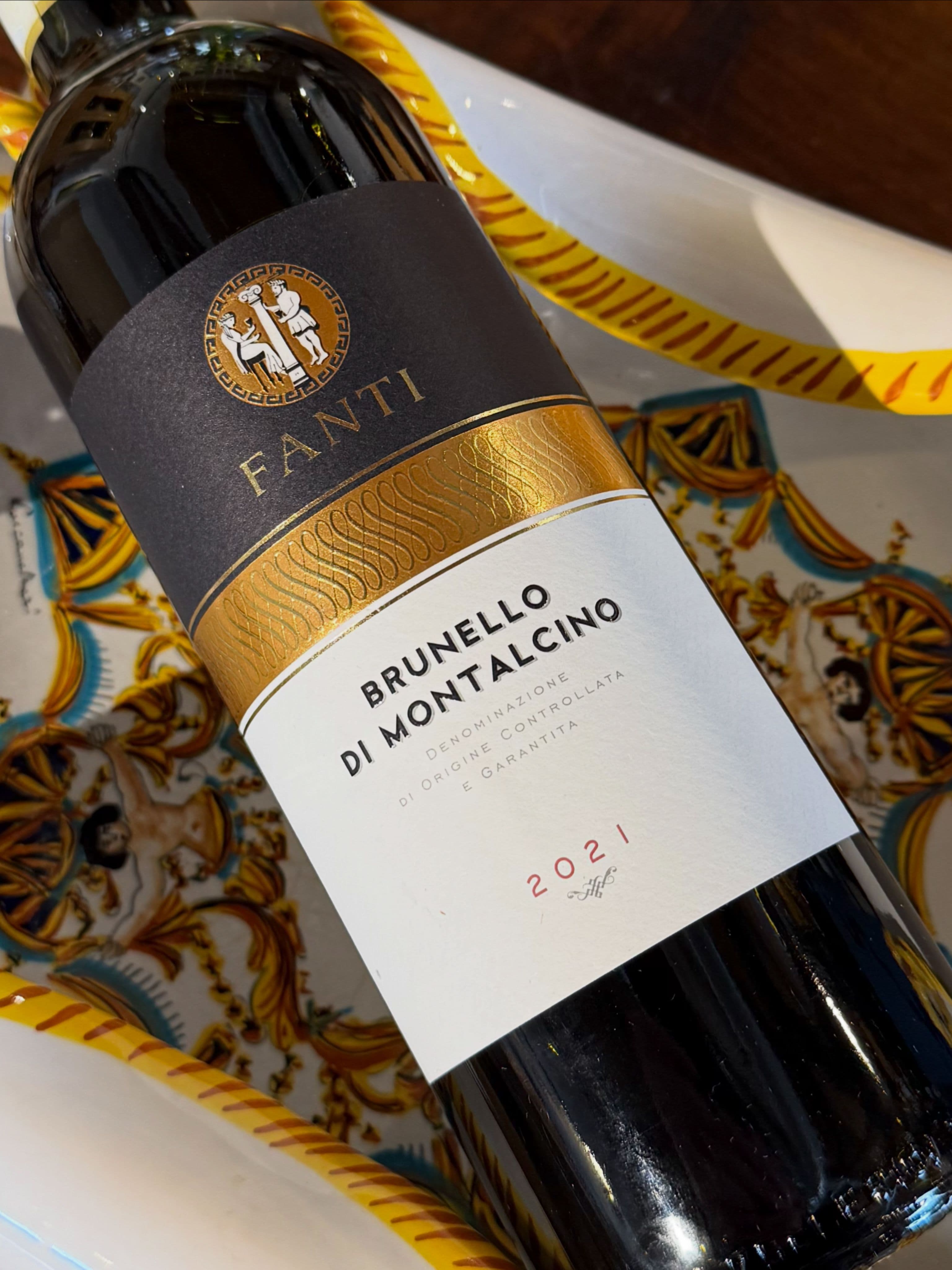 An Italian Tuscan bottle on rustic wood, from the Brunello shelf at The Clown